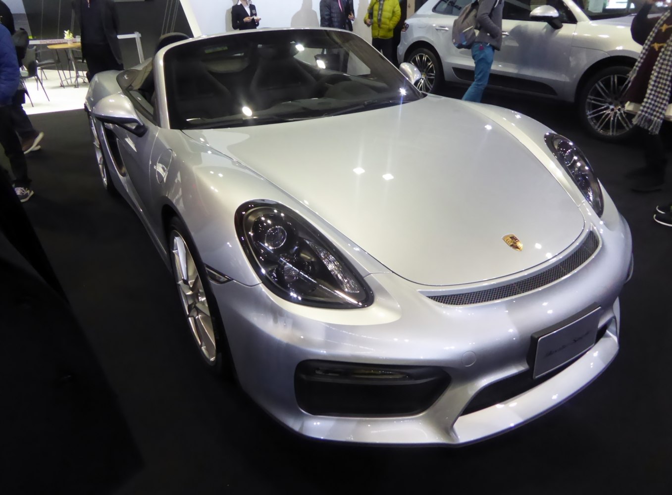 Silver convertible with sleek aerodynamic front and distinctive headlights