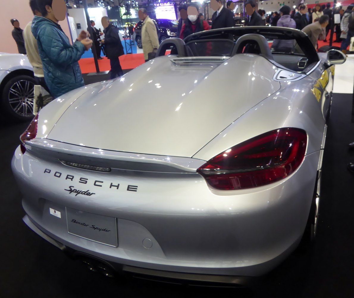 Rear view of a convertible with distinctive taillights and dual exhaust pipes