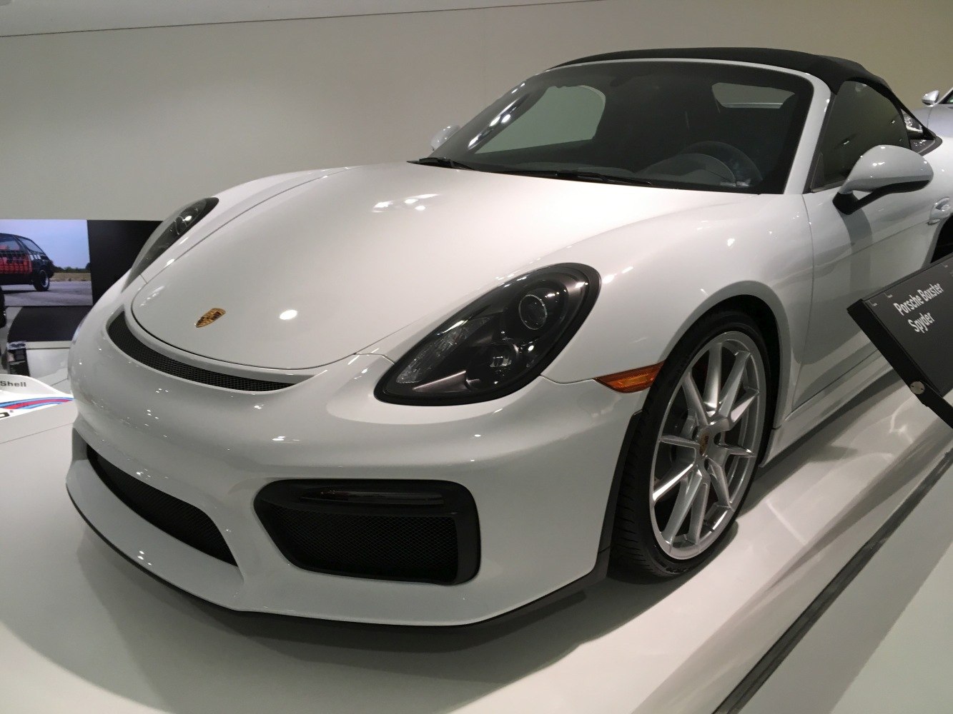 Front view of sleek car with headlights and alloy wheels