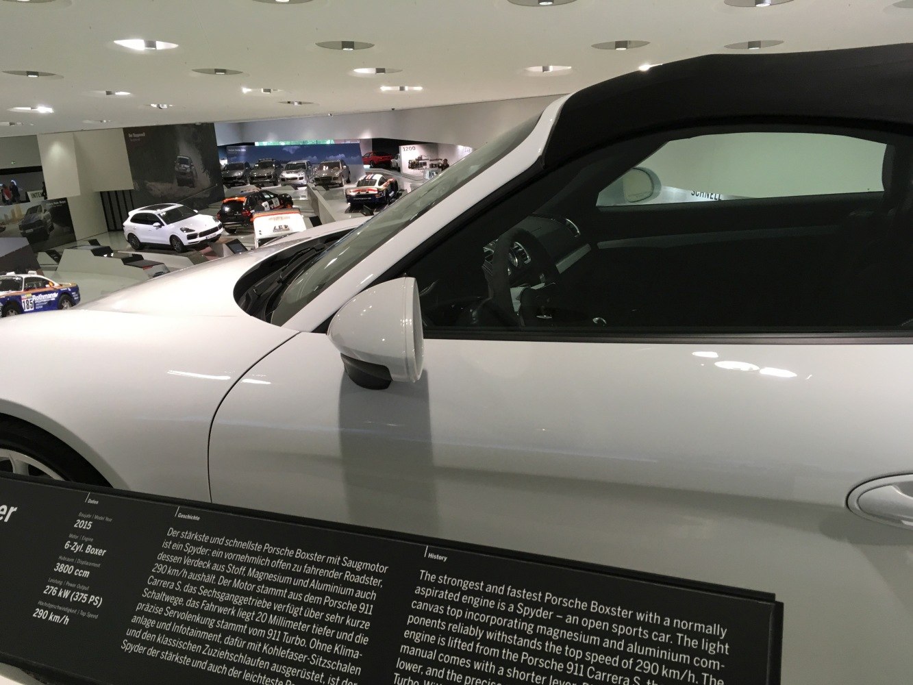 Side profile with soft-top roof and visible interior cockpit details