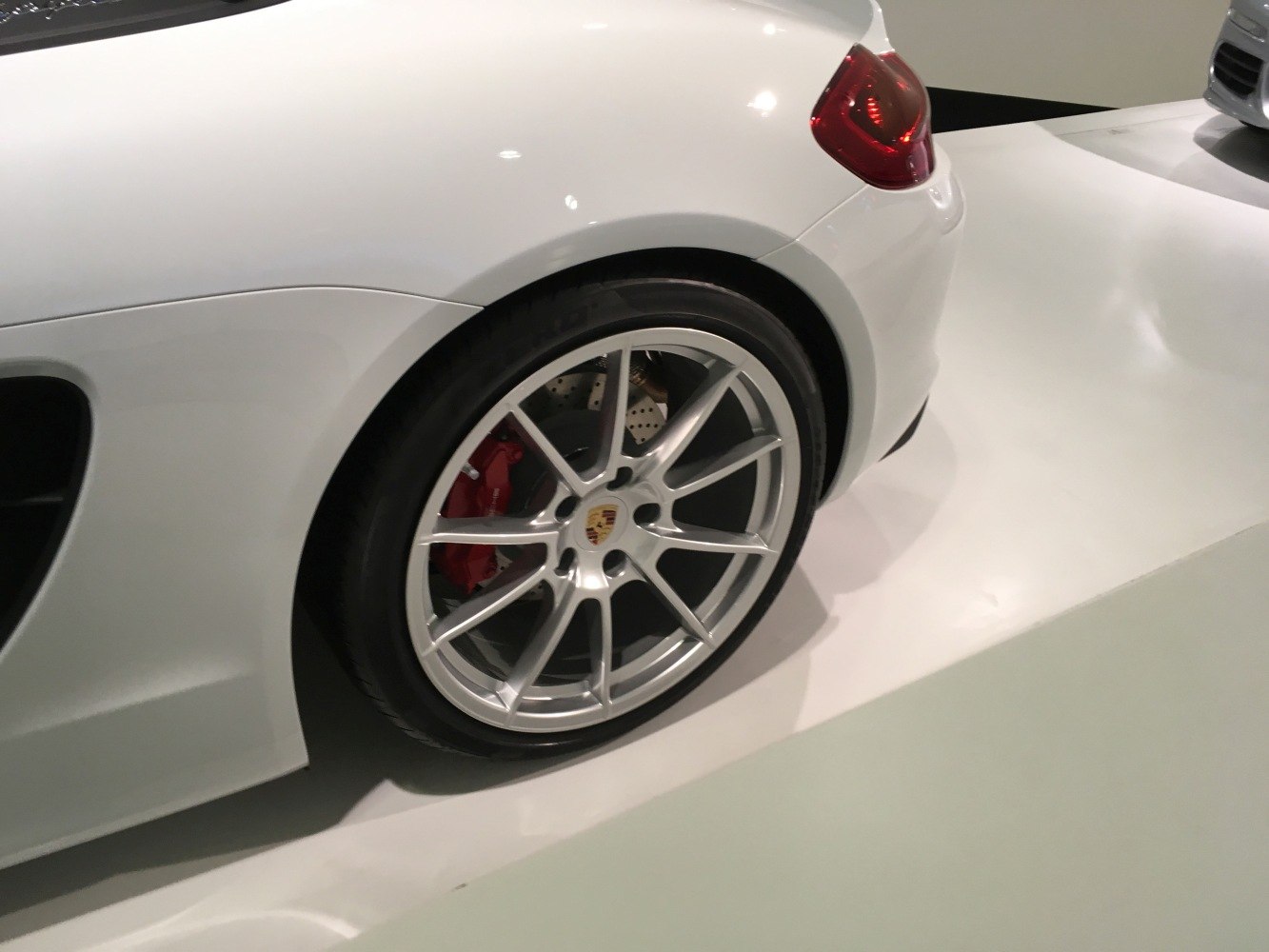 Rear wheel with alloy rim and red brake caliper