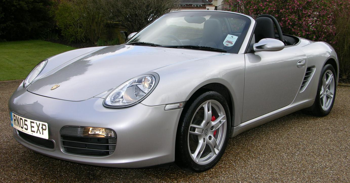 Silver convertible roadster with rounded headlights and alloy wheels