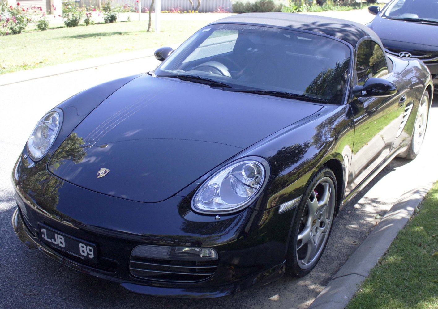 Close-up of convertible front with headlights and sleek hood design