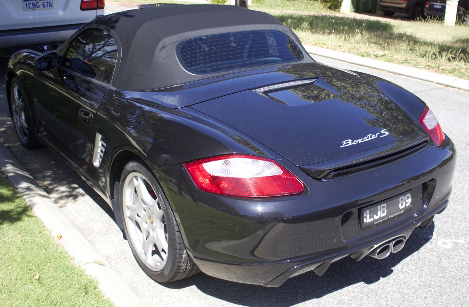 Convertible soft top rear and side view with dual exhaust