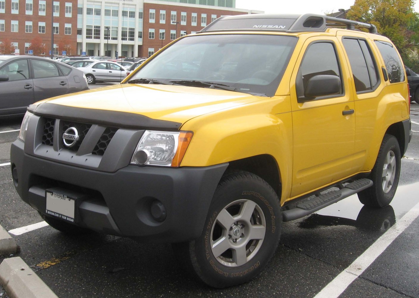 Yellow SUV with rugged front grille and roof rack