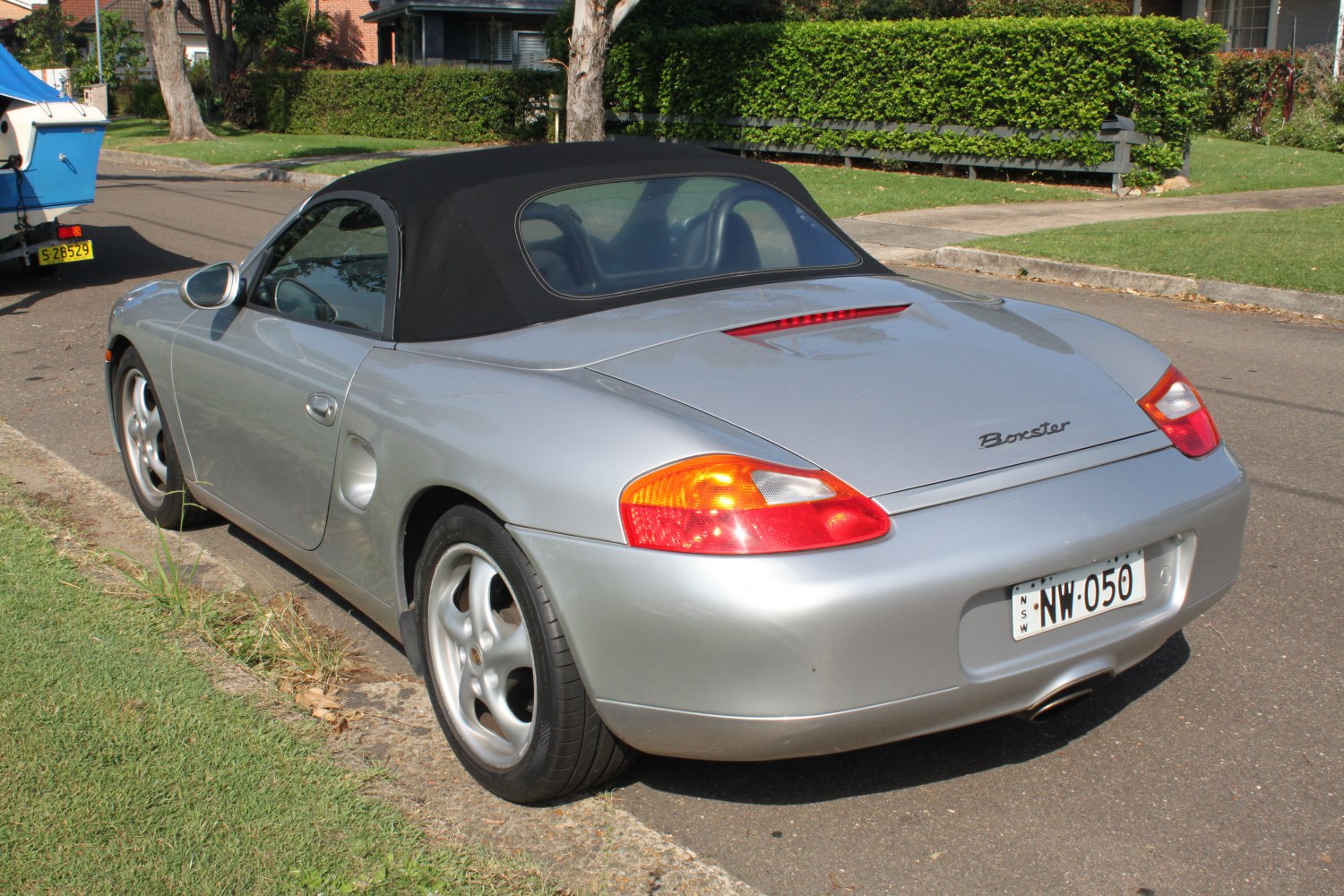 Soft-top convertible rear view with taillights in silver