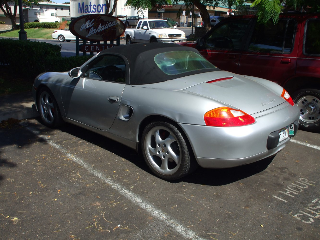 Convertible sports car rear and side view with tail lights and side air intake