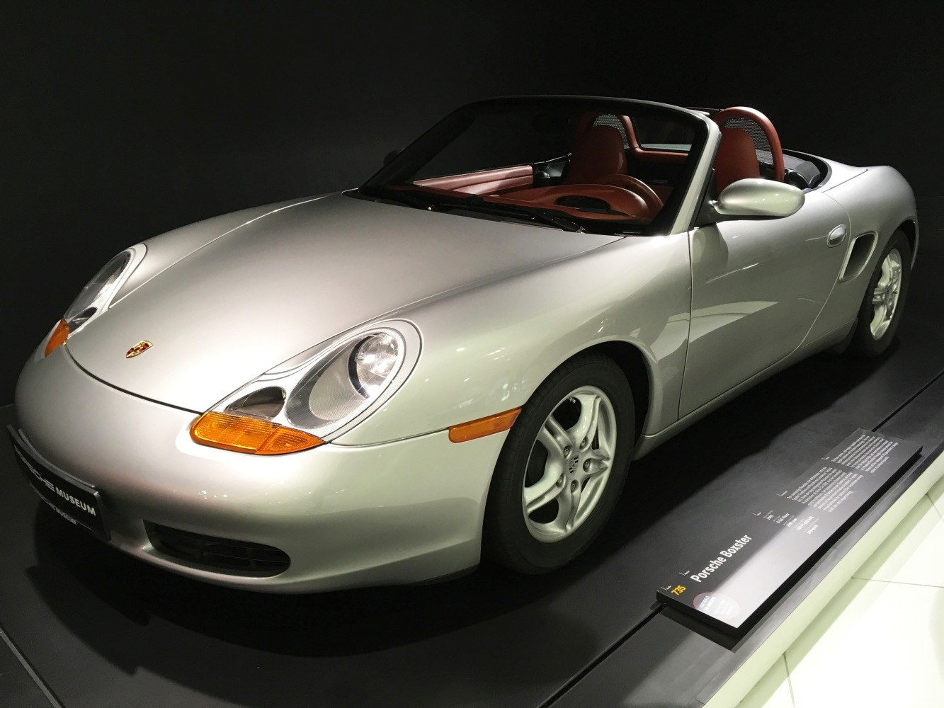 Convertible roadster with silver finish and alloy wheels, open-top two-seater design
