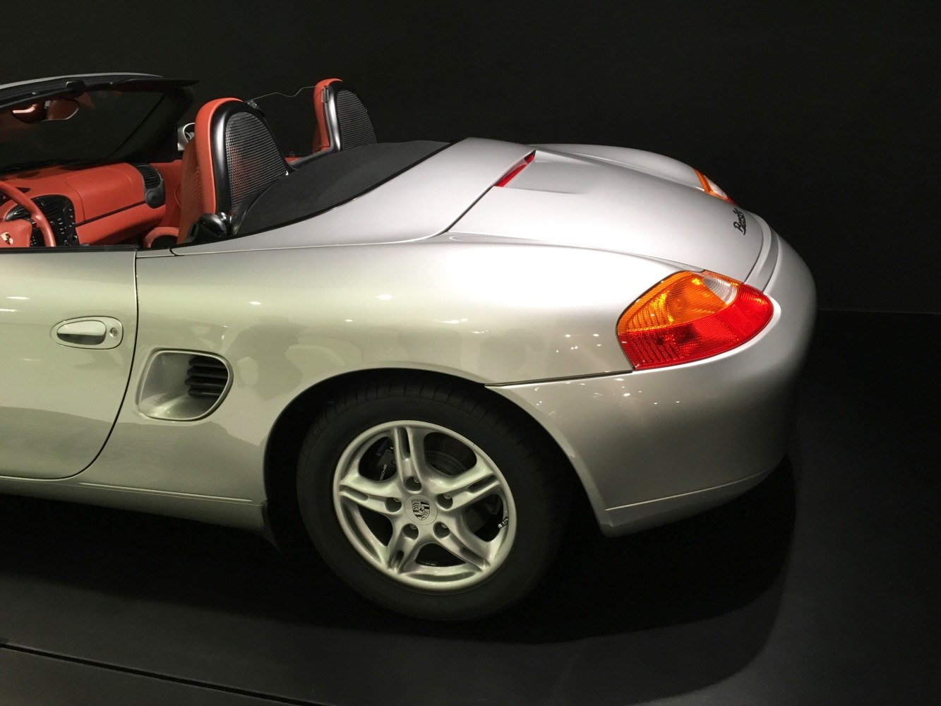 Convertible rear side with silver body and orange leather interior