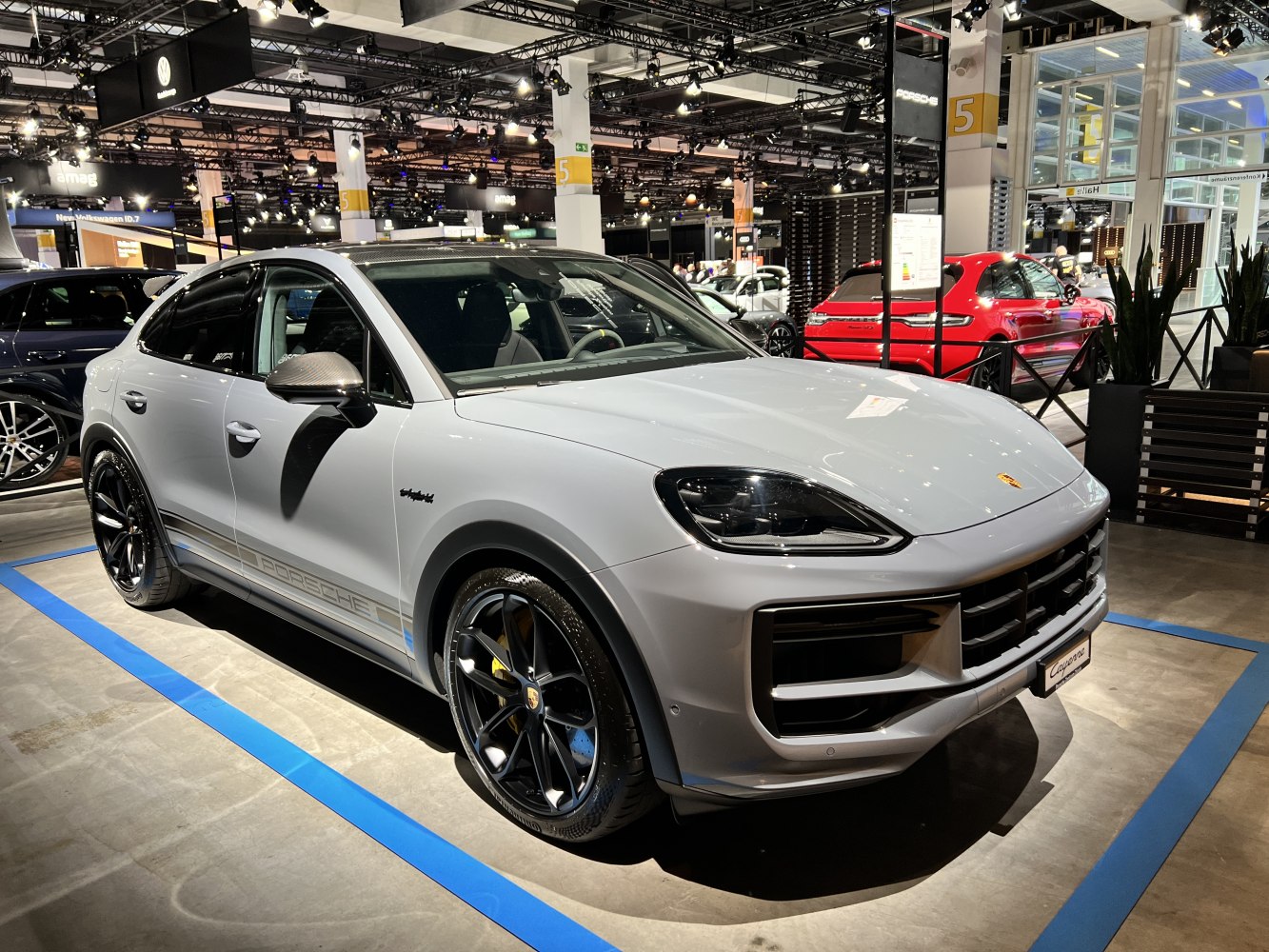 Front-side view with sleek headlights and black alloy wheels