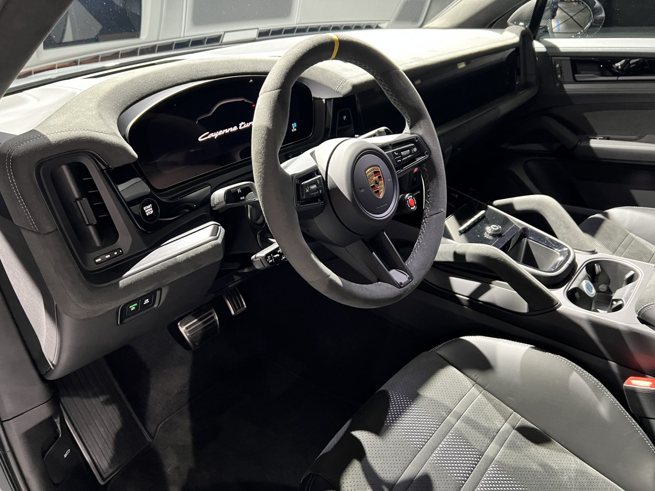 Digital dashboard and Alcantara steering wheel in luxury SUV interior
