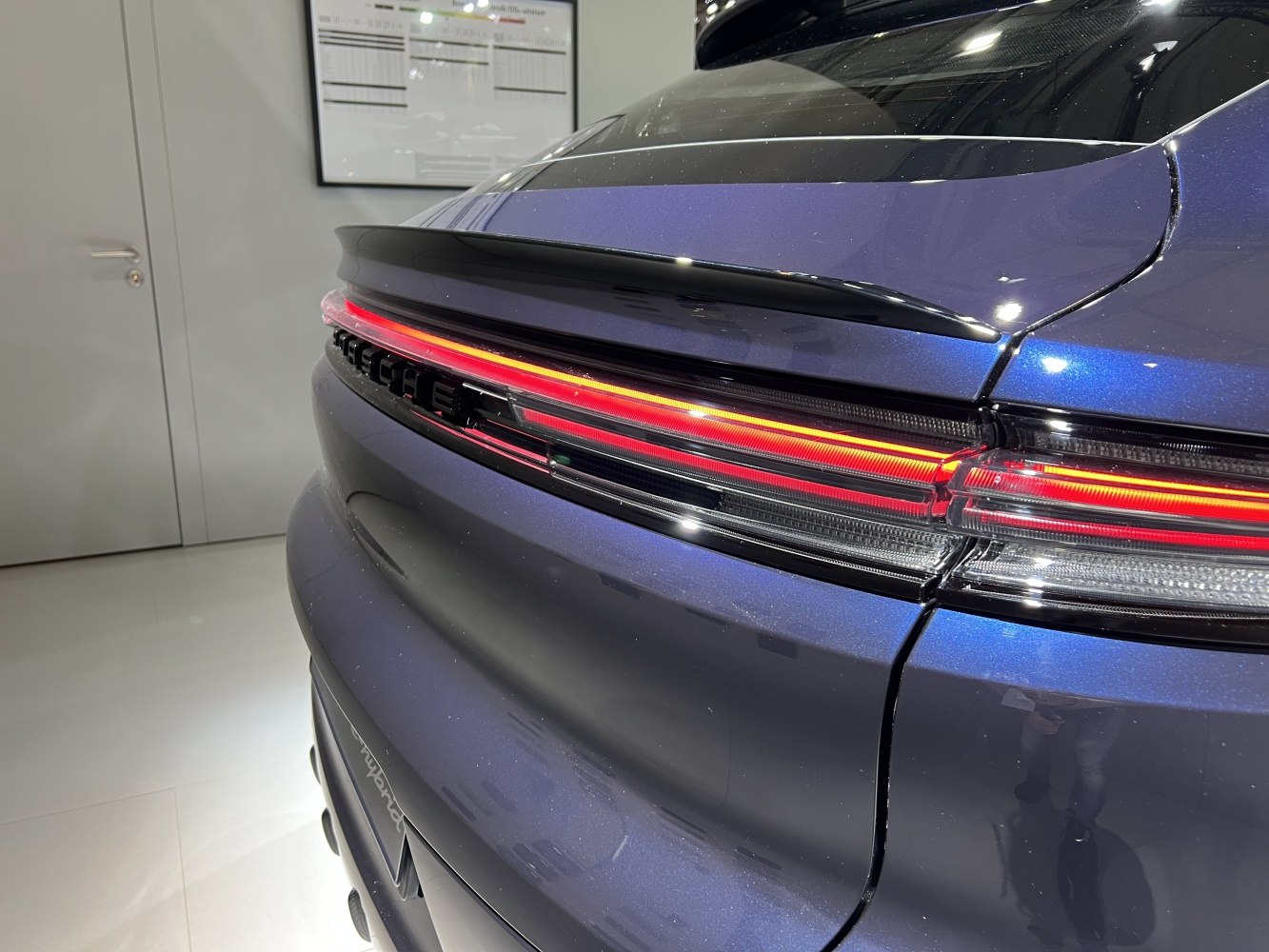 Rear LED light strip and spoiler on a modern luxury coupe SUV rear