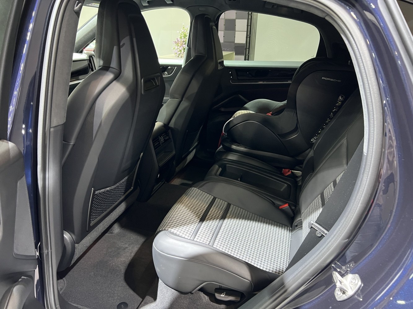 Rear seat interior with leather upholstery and child seat installed
