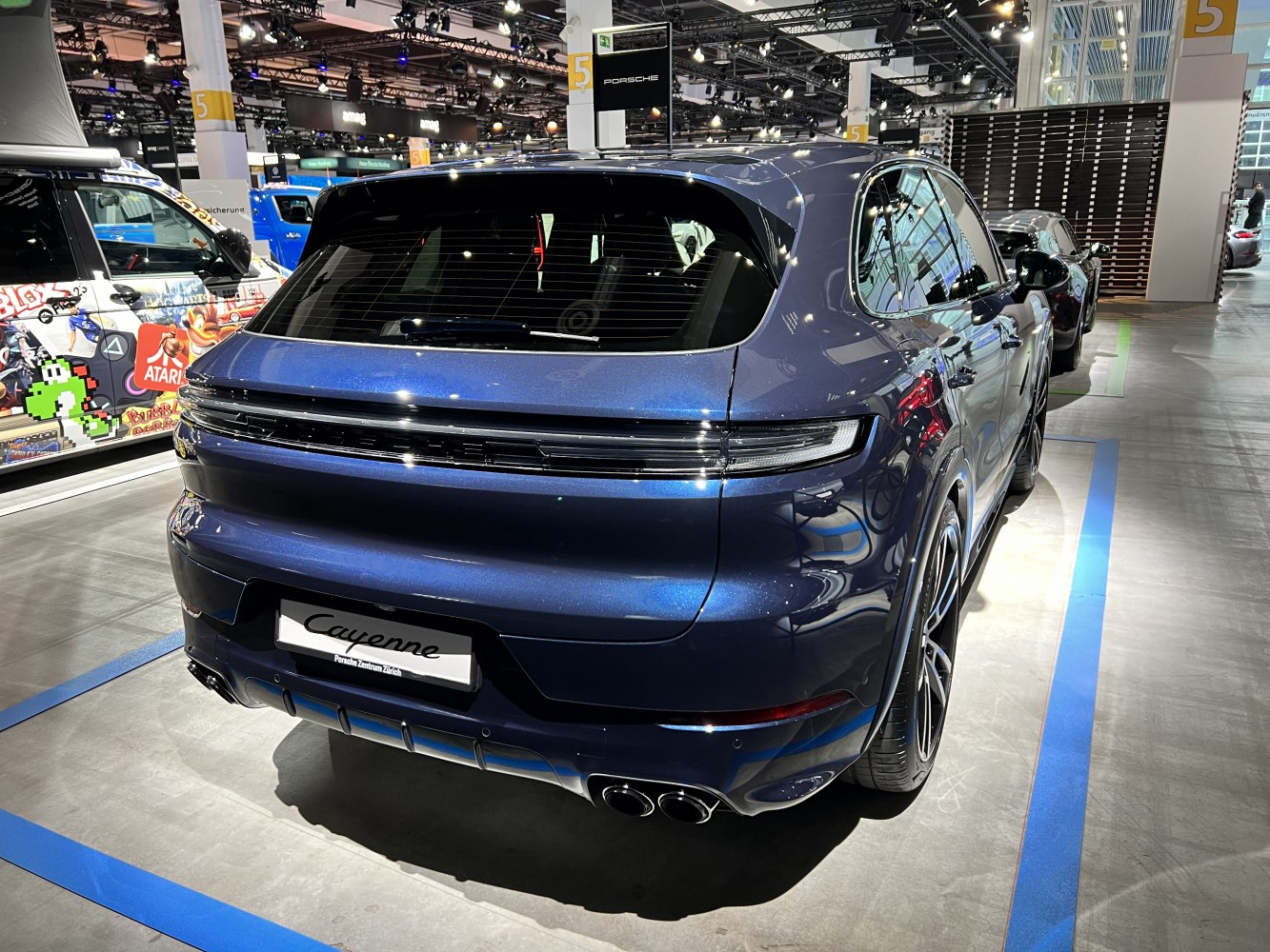 Modern SUV rear with sleek taillights and quad exhaust tips