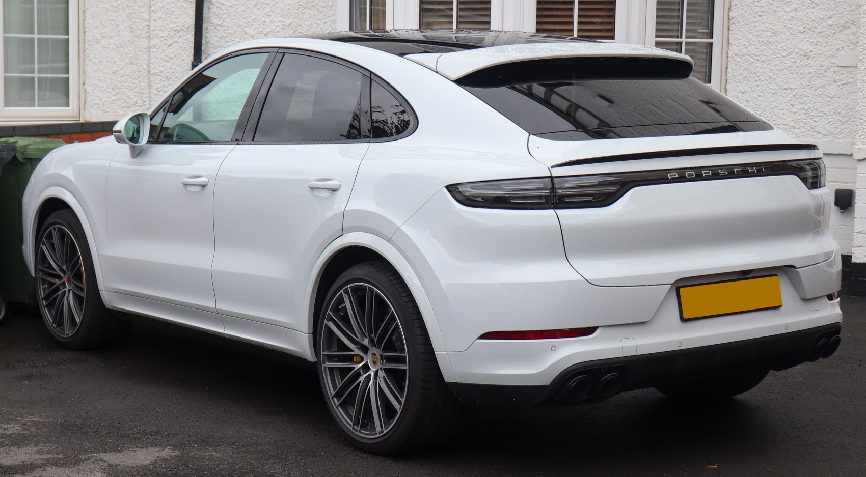Rear and side profile with sleek coupe design and modern taillights