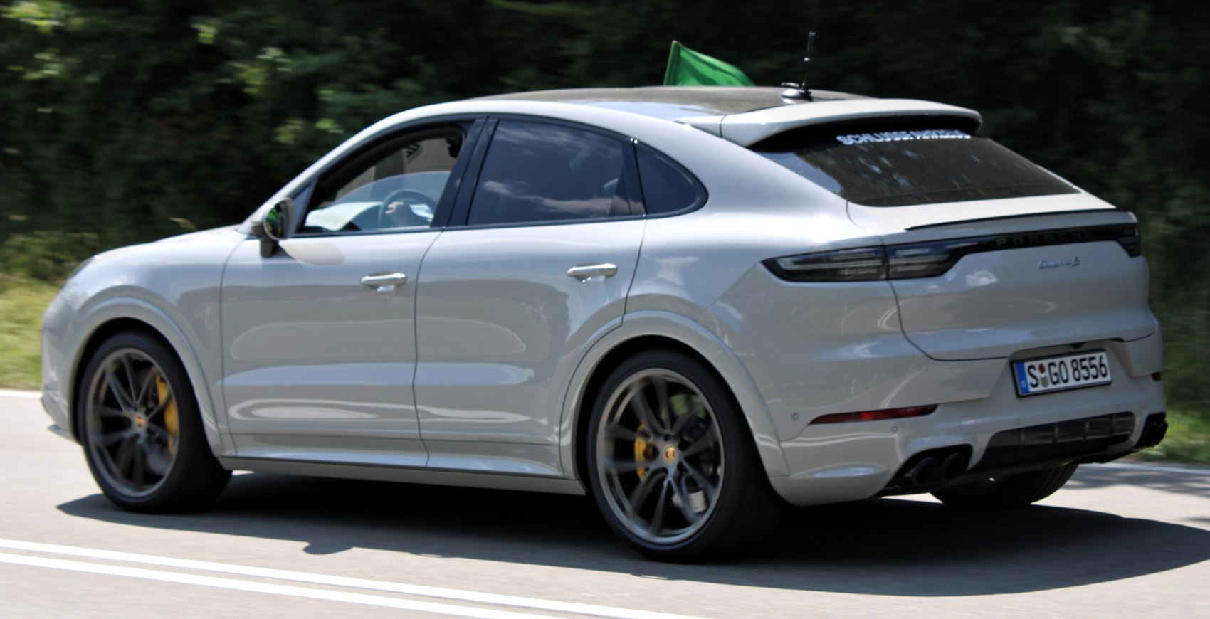 Rear side profile with curved roofline and large alloy wheels