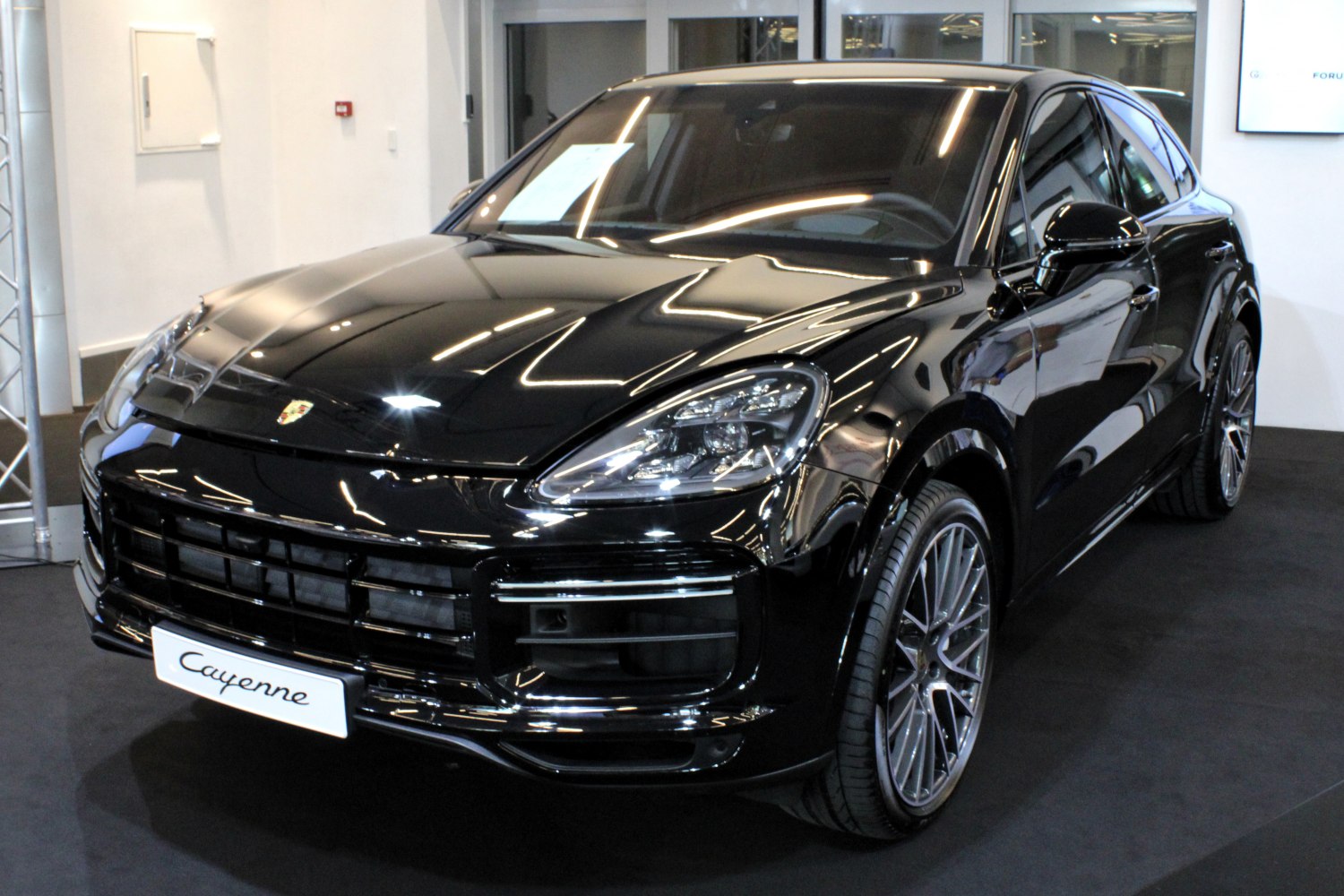Black coupe SUV with aggressive grille and LED headlights