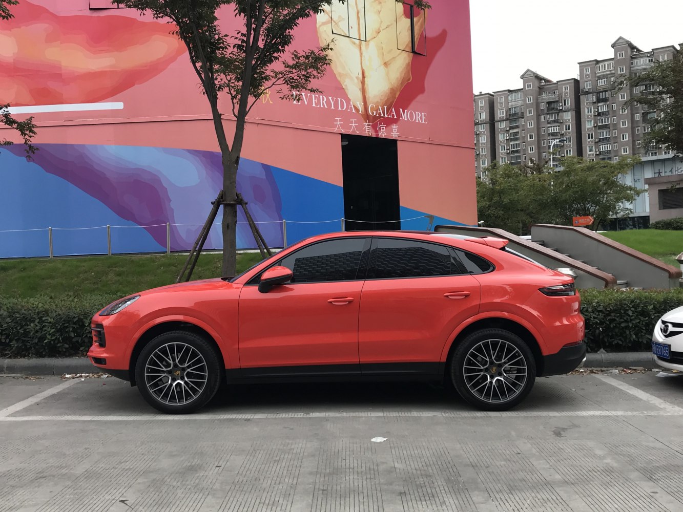 Side profile of sporty coupe SUV with tinted windows and alloy wheels