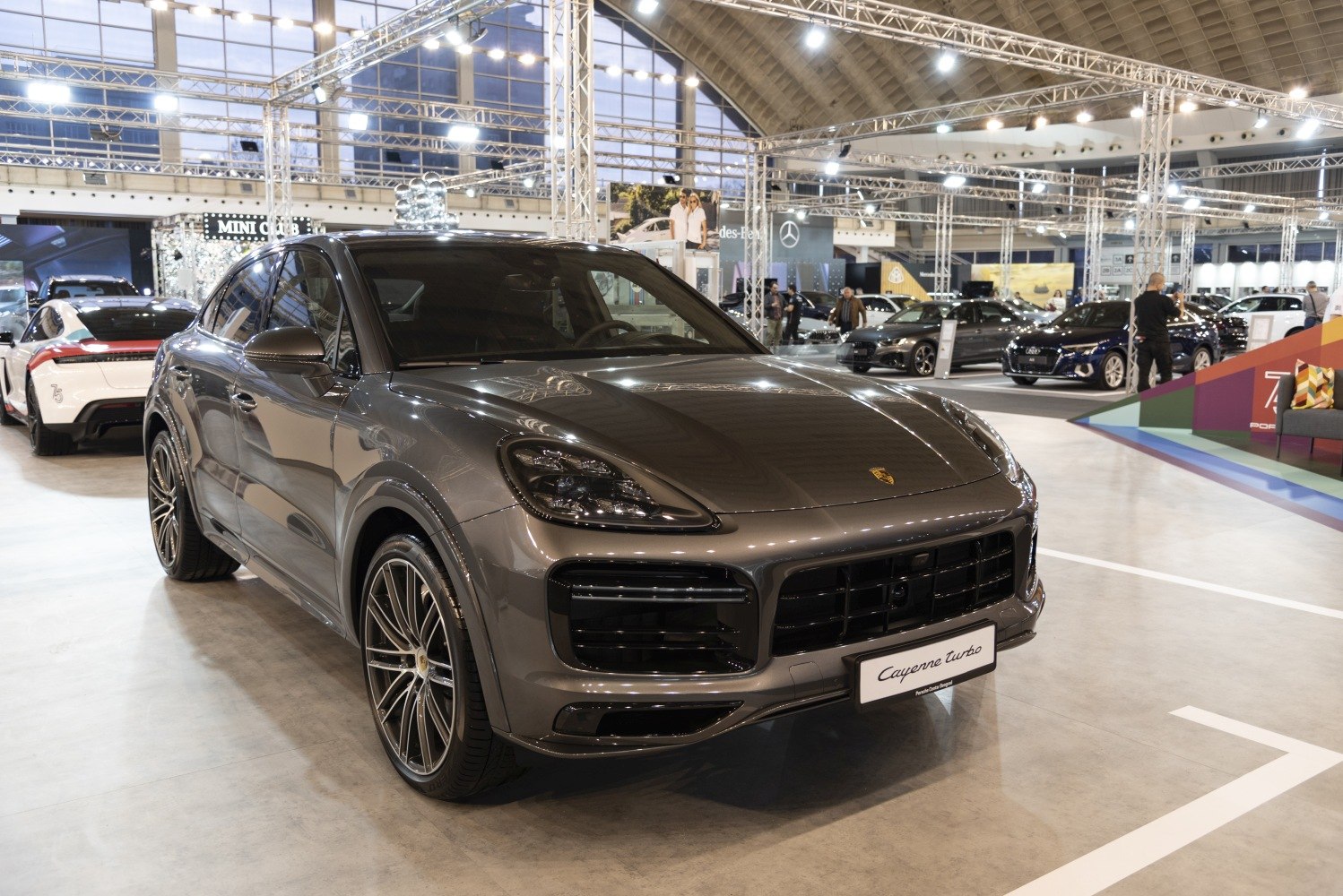 Luxury SUV coupe with sporty alloy wheels and aggressive front grille.