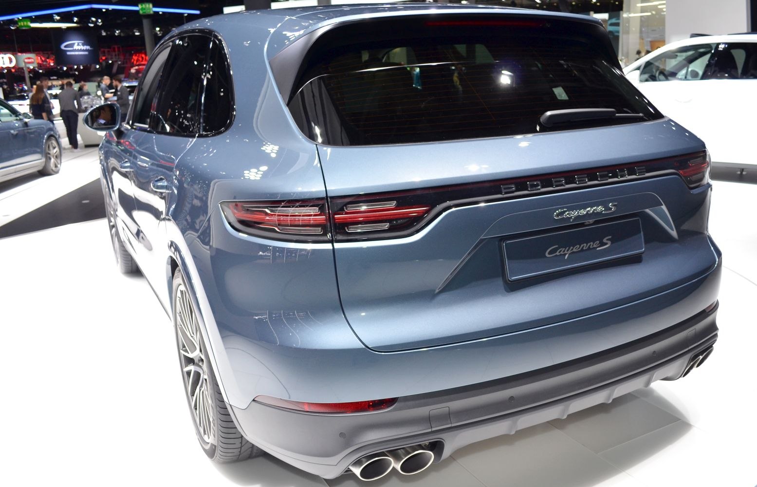 LED taillights and quad exhaust tips on modern SUV rear