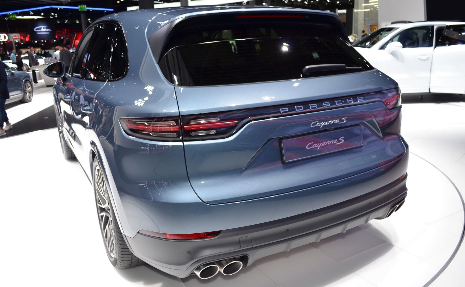 Rear view with LED tail lights and quad exhaust of a sporty SUV