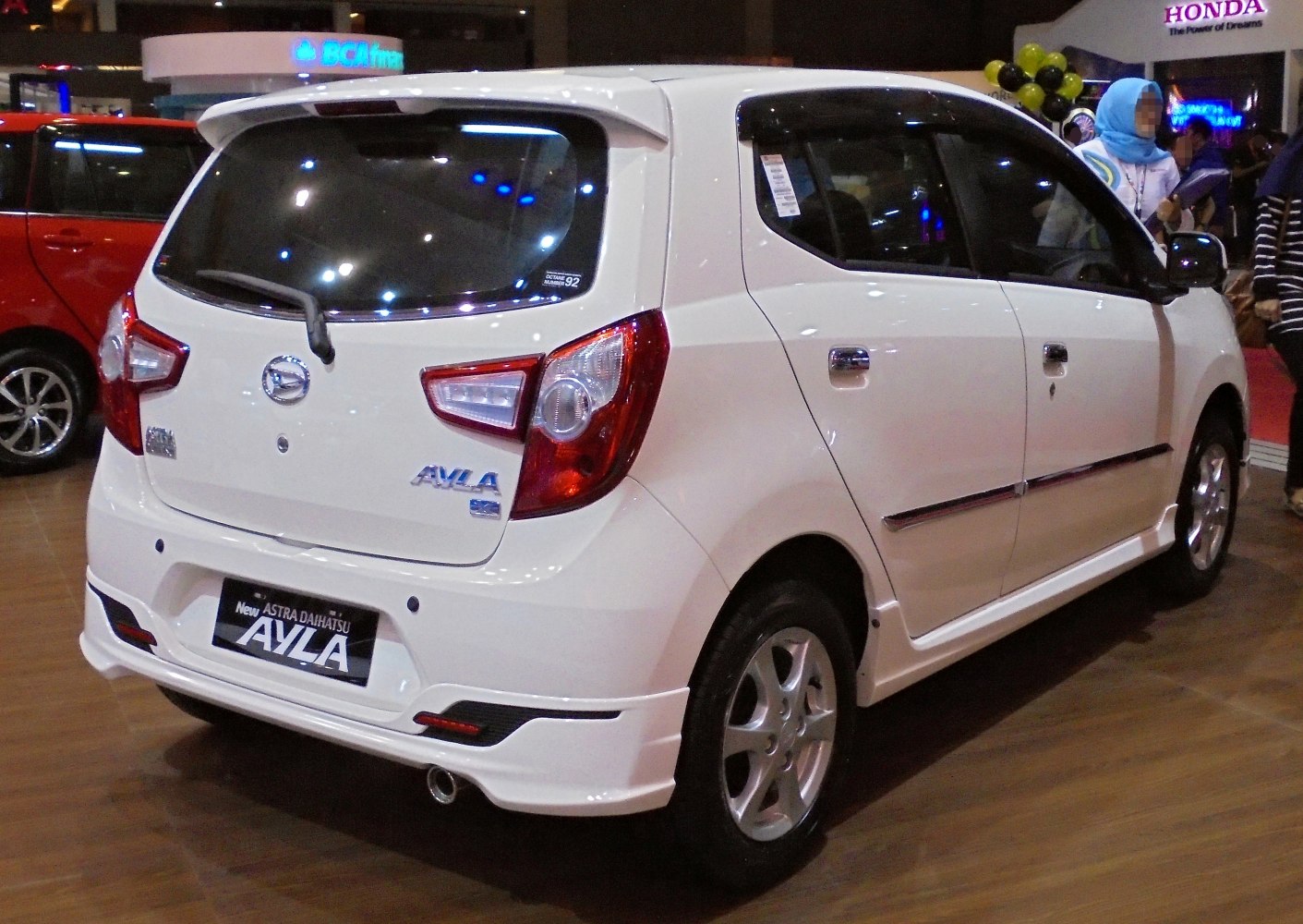 Rear and side view of compact hatchback with distinctive tail lights