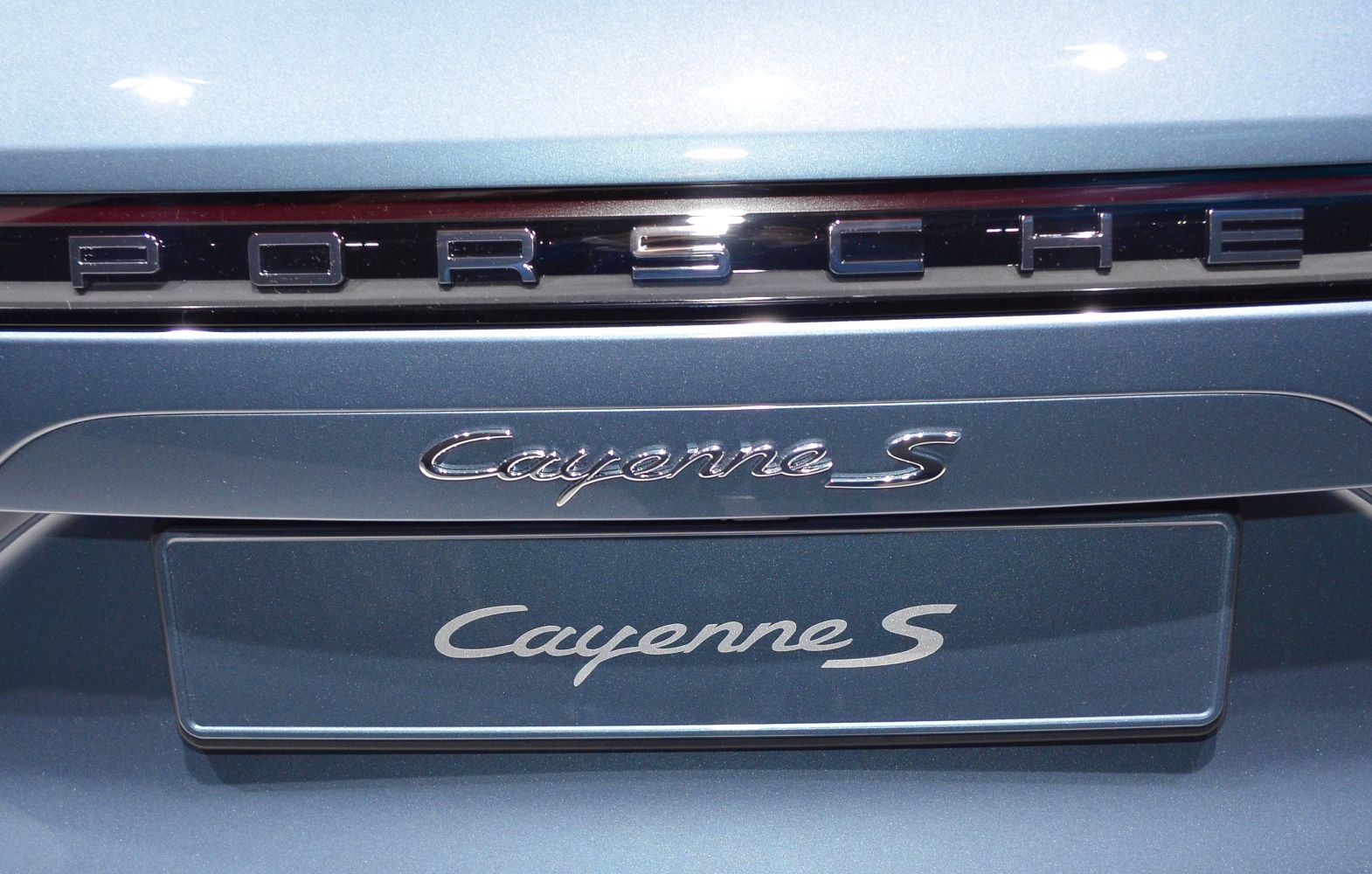Close-up of elegant Porsche Cayenne S trunk badge and lettering