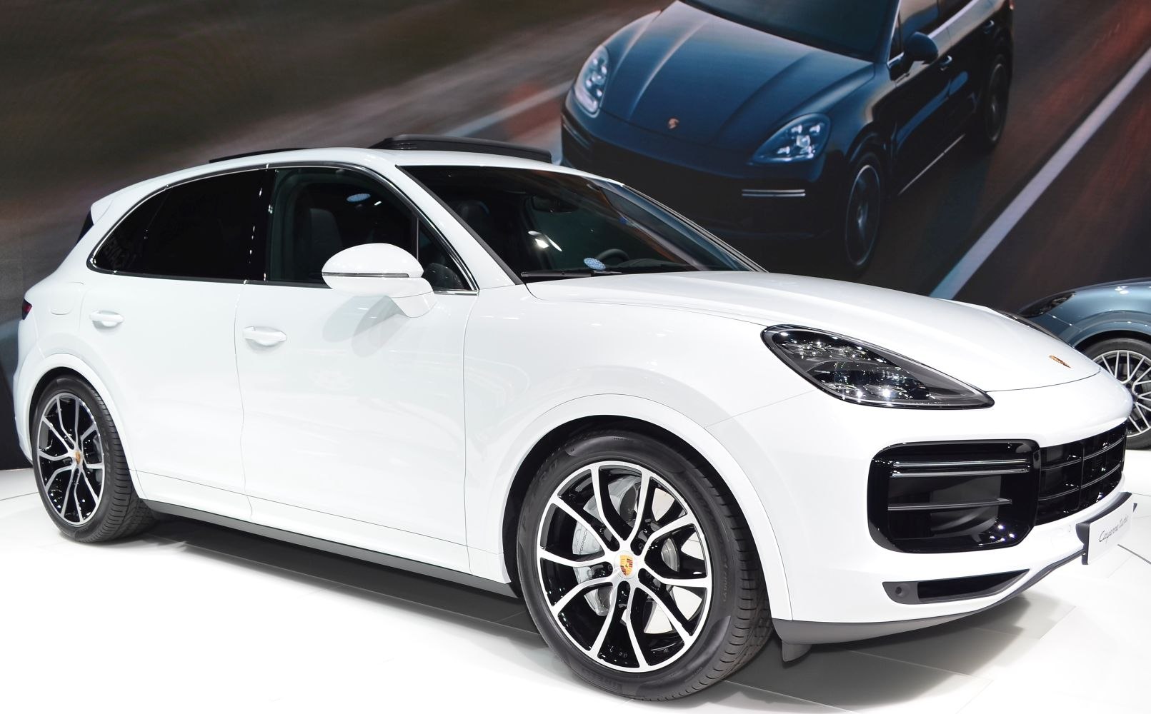 White SUV with distinctive LED headlights and dual-tone alloy wheels.