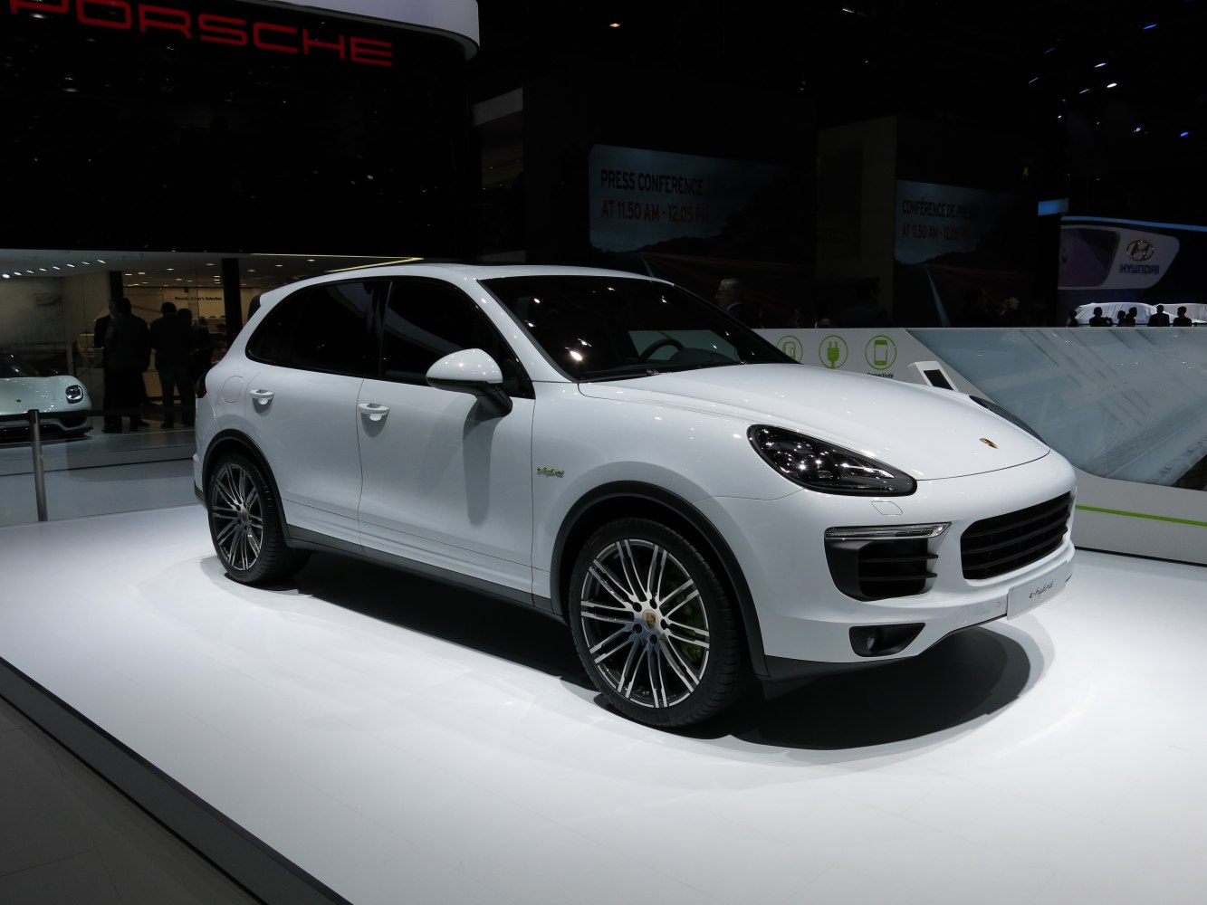 White luxury SUV with sleek design and large alloy wheels