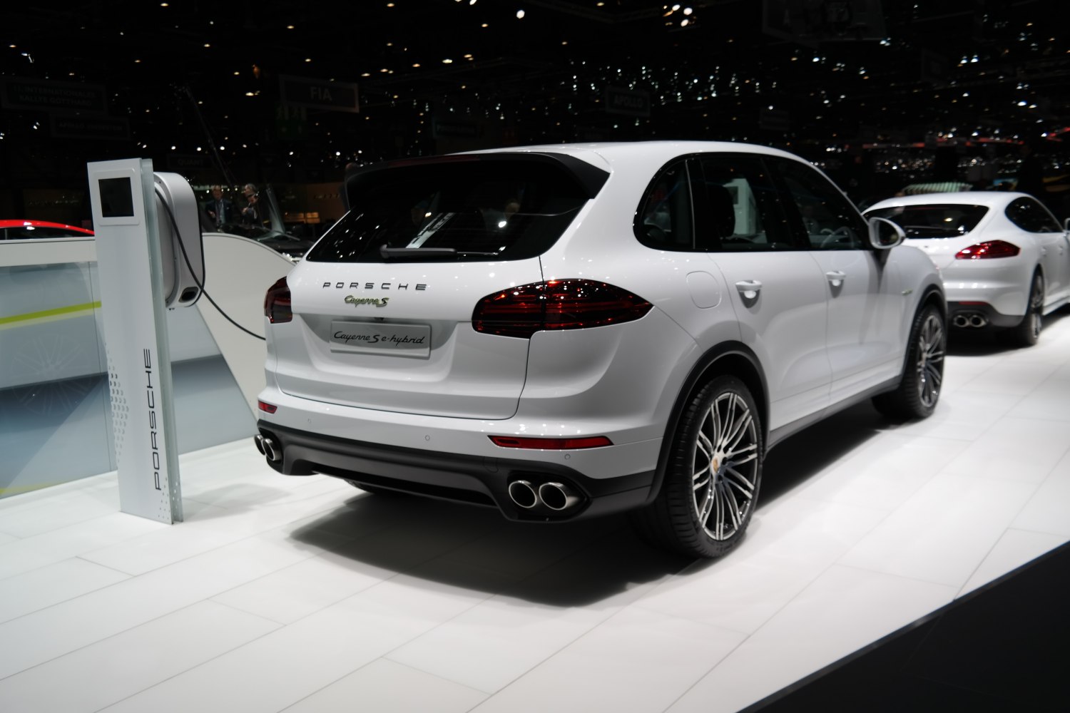 Rear view of plug-in hybrid SUV with quad exhaust and charging port