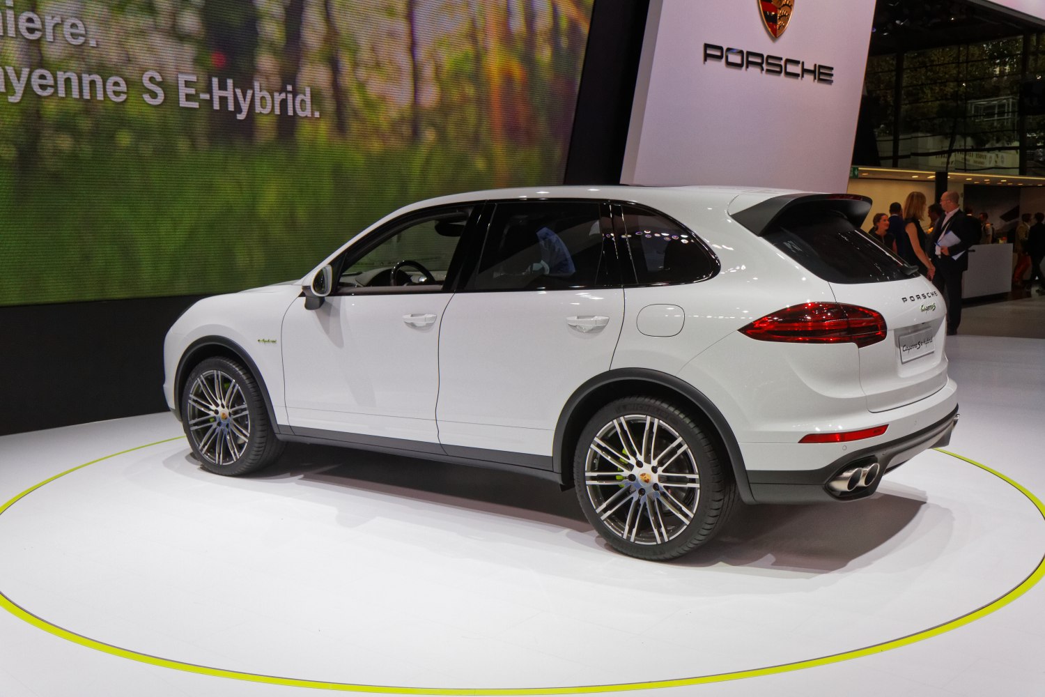 White SUV rear-side view with sporty wheels and quad exhausts
