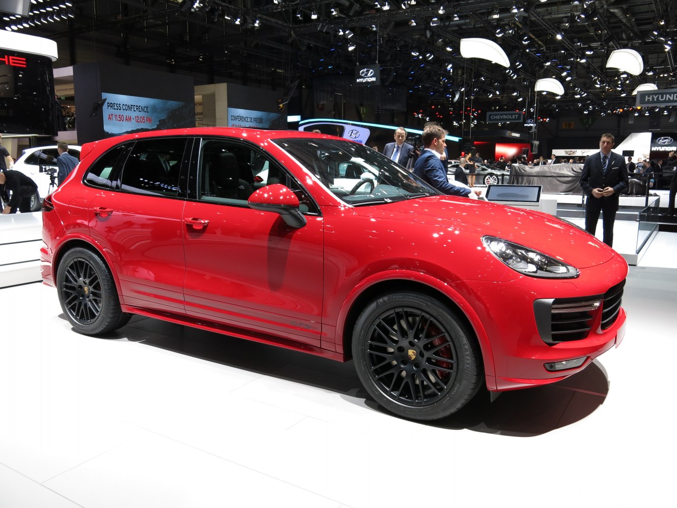 Red SUV with black multi-spoke wheels and distinct sporty design