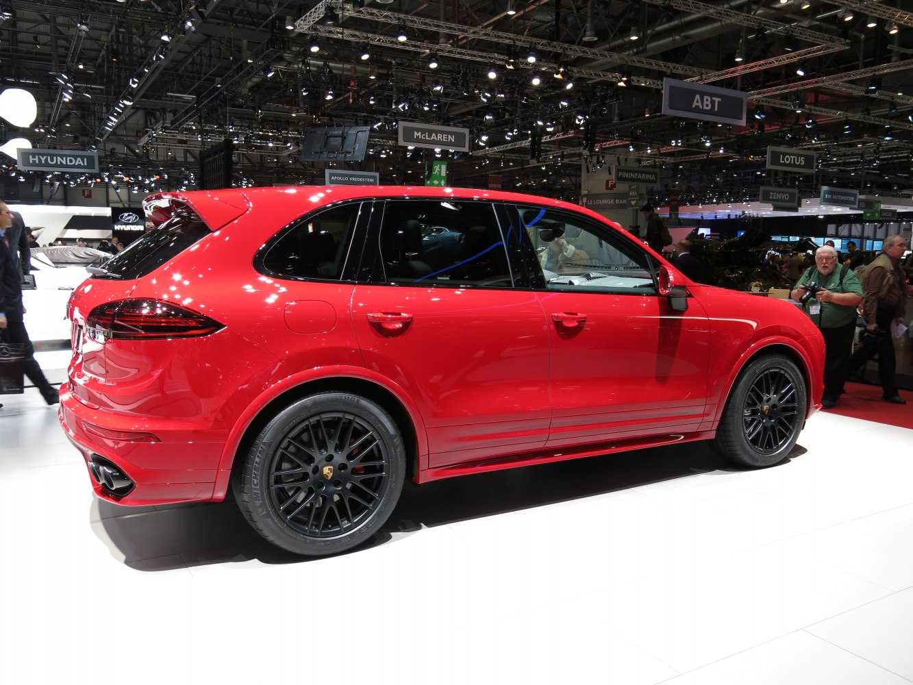 Red luxury SUV with black alloy wheels and sleek design