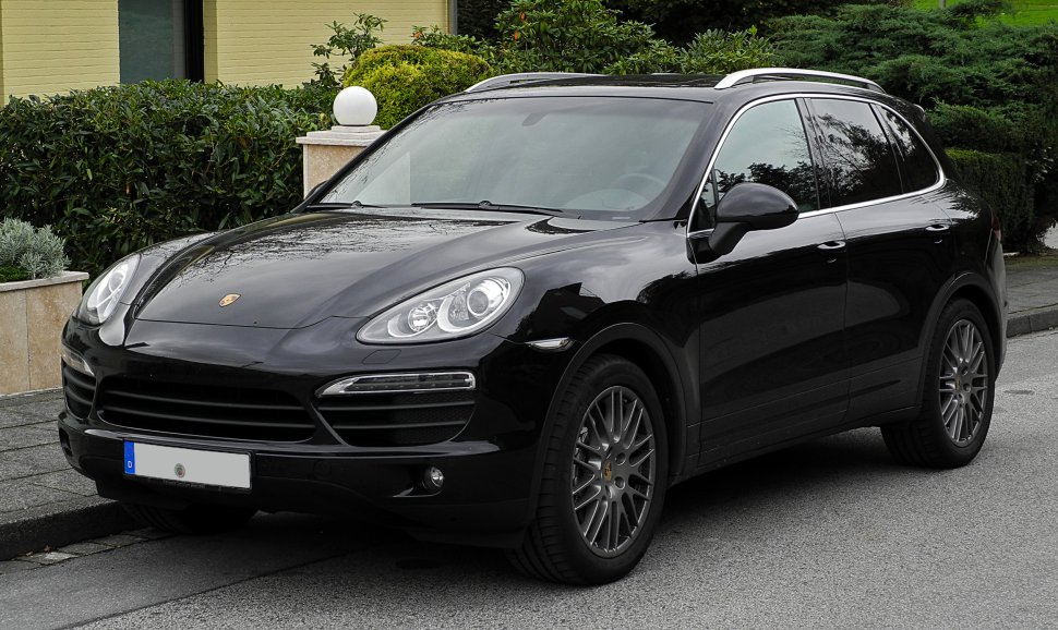 Black SUV front-side view with sleek headlights and alloy wheels