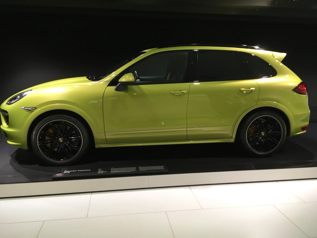 Side view of a sporty SUV with sleek design and black wheels