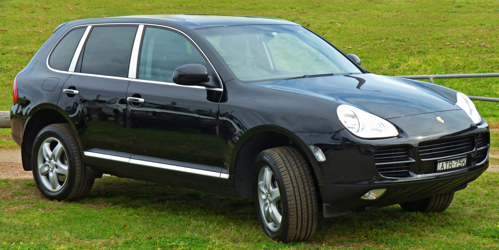 Front-side view of black SUV with alloy wheels