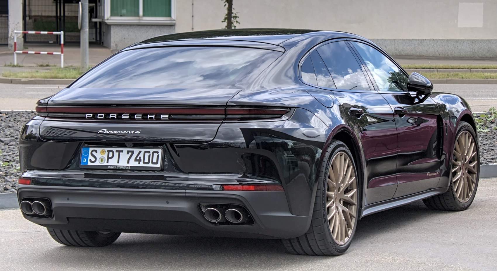 Sleek rear end with quad exhaust and continuous LED tail light strip