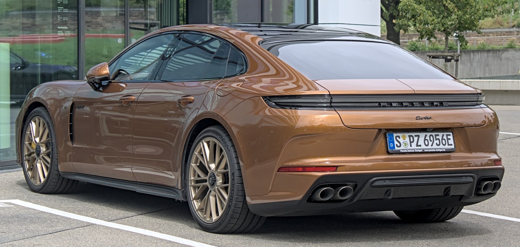 Sleek rear design with quad exhaust tips and aerodynamic shape