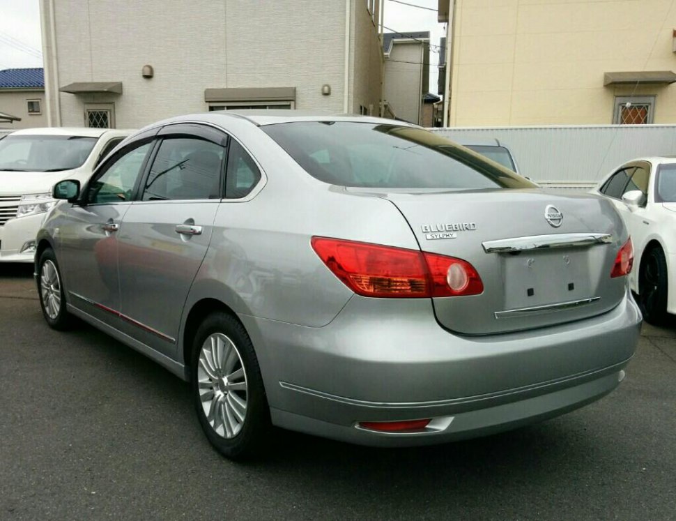 Silver sedan rear with distinct taillights and alloy wheels