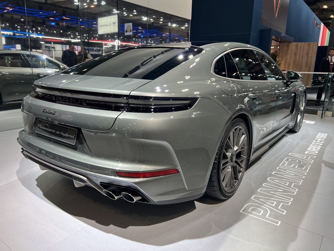 Rear view of a luxury hybrid sedan with quad exhaust tips