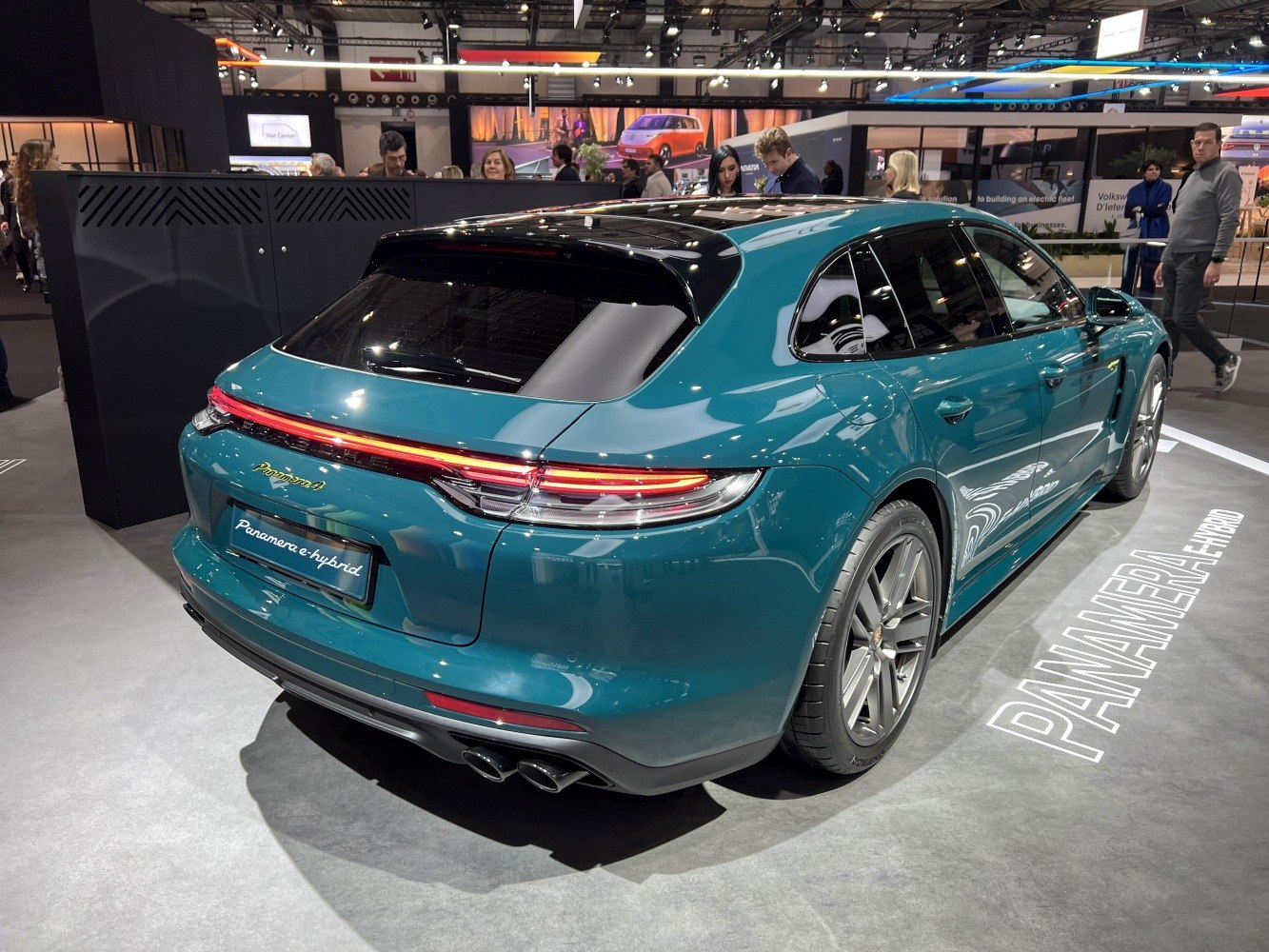 Rear view LED tail lights and quad exhaust of hybrid wagon