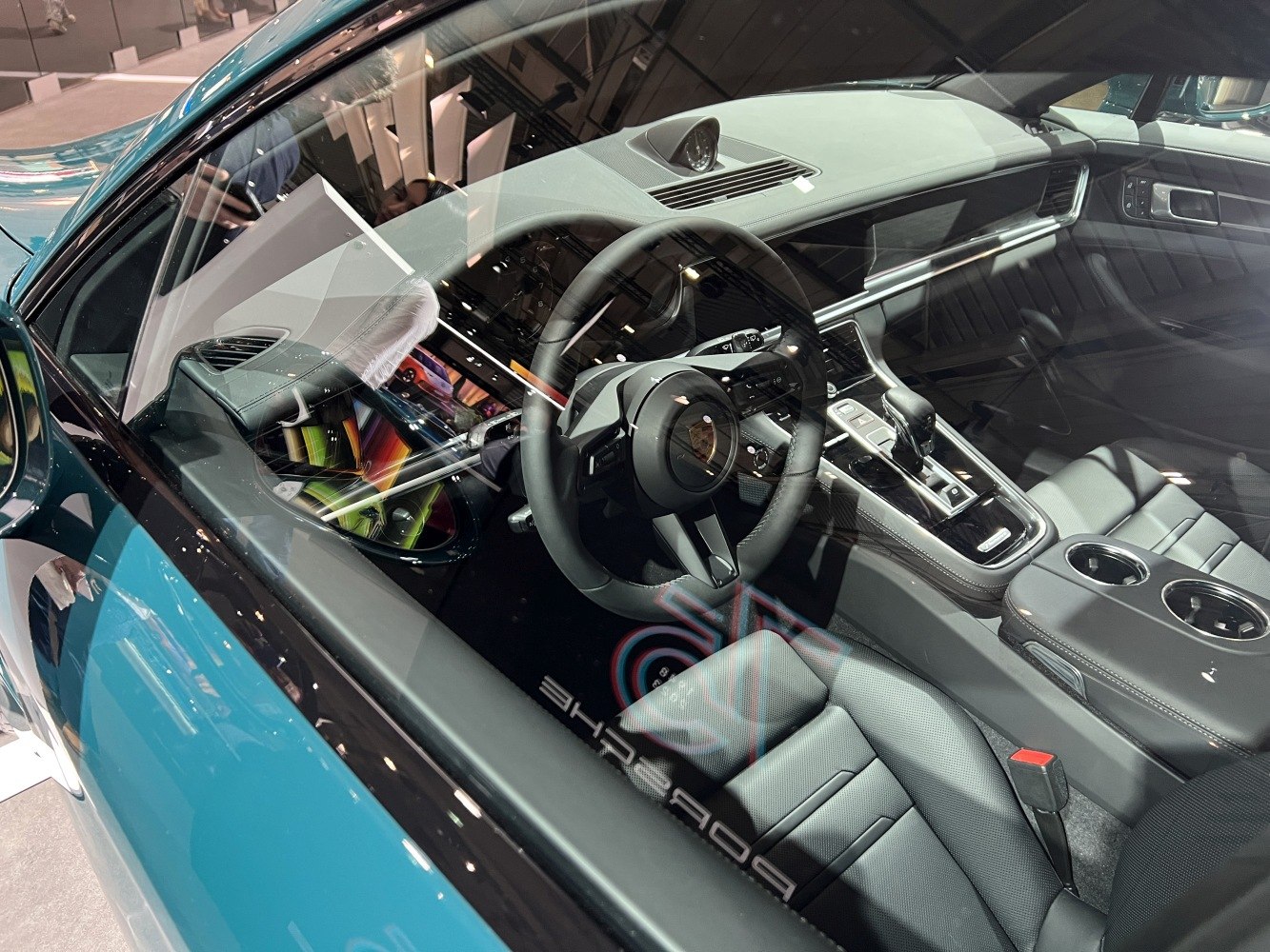Luxury car interior with steering wheel and center console