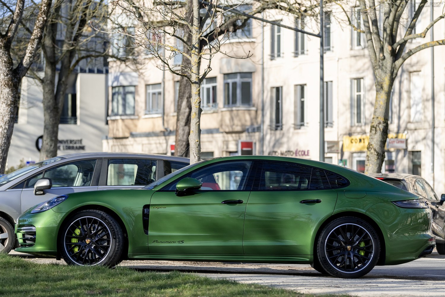 Green luxury sports sedan with black alloy wheels