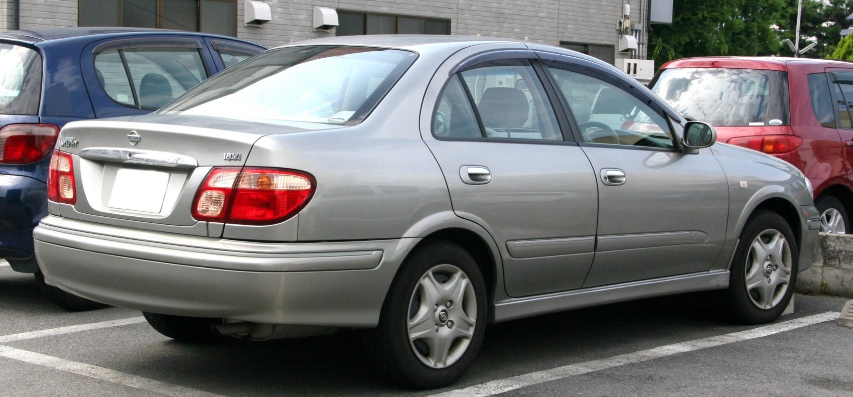 Rear and side view of mid-size sedan with alloy wheels