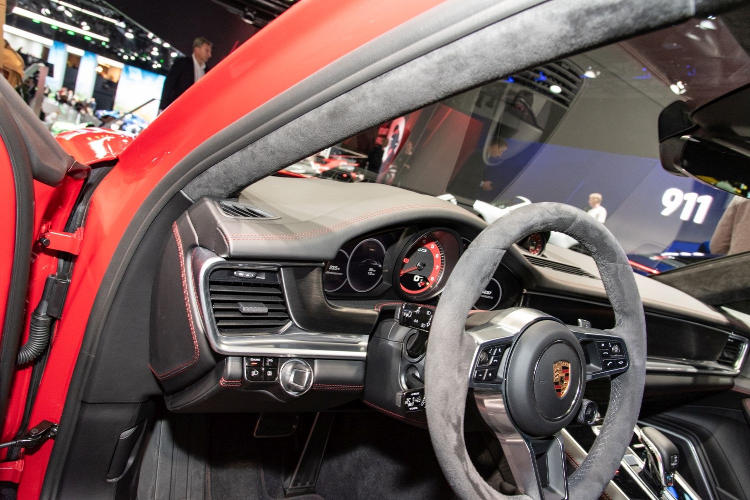 Dashboard and suede steering wheel of luxury performance car interior