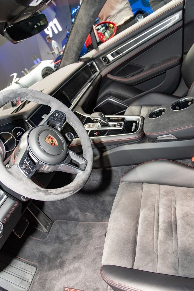Suede steering wheel and premium center console with cup holders.