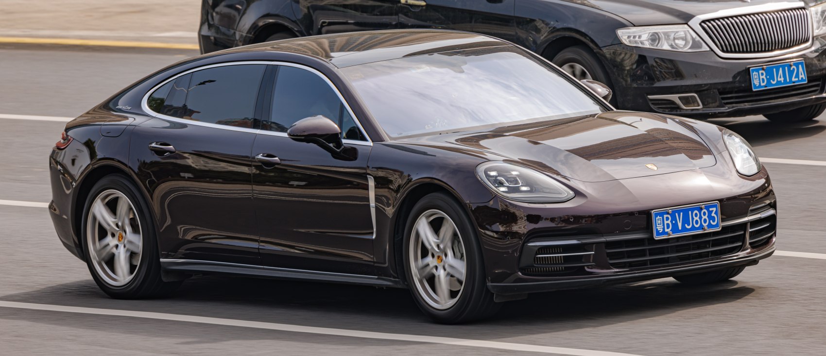 Aerodynamic luxury executive sedan with LED headlights and sleek side profile