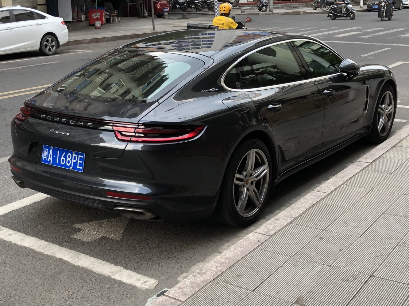 Rear view with sleek LED tail lights and aerodynamic body design