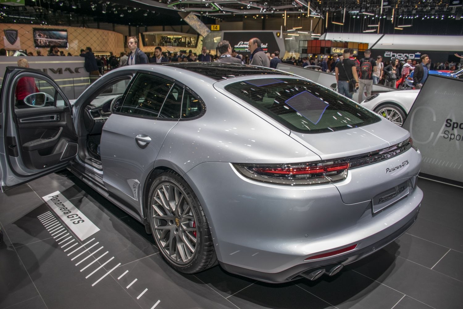 Rear and side profile with open door and sporty wheels