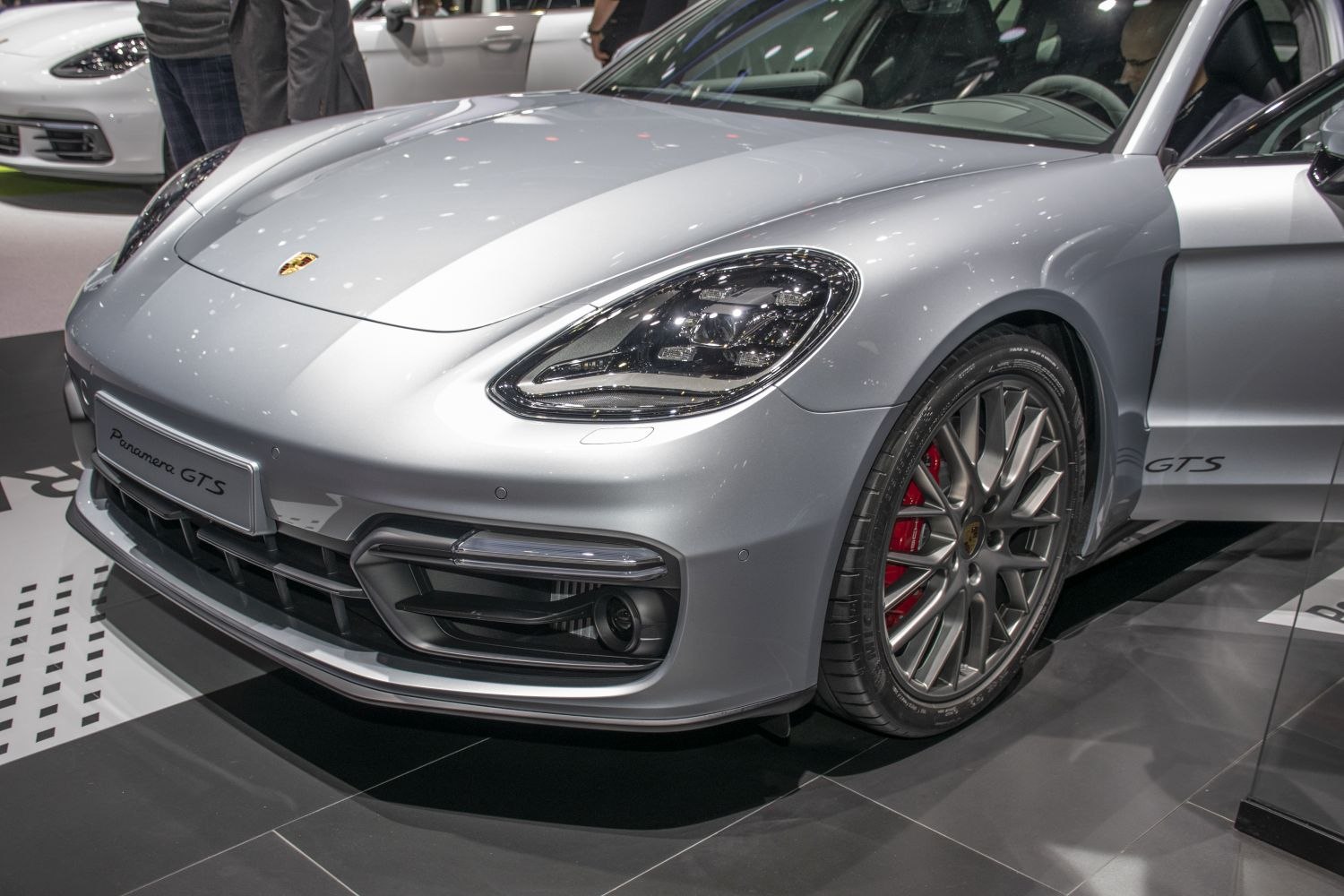 Front headlight and sporty alloy wheel with red brake calipers